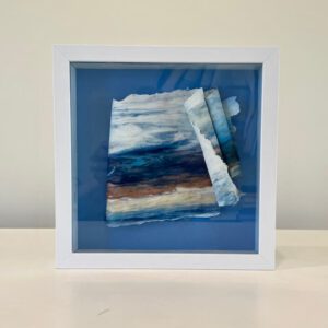 ?. A blue and white frame with a piece of paper on it.